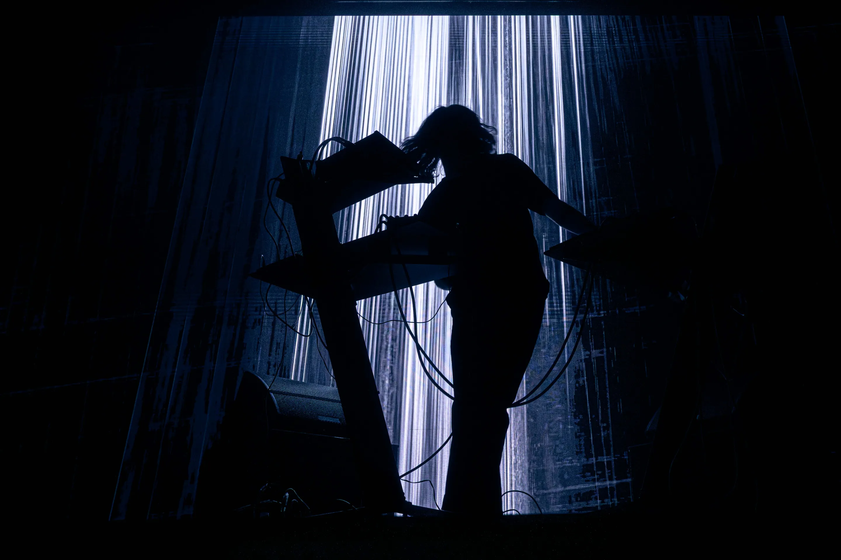 Musicians playing live at a concert, engaging with the audience and delivering an electrifying performance